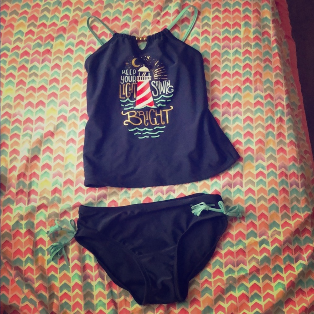Over belly swimming suit with beads at the top.